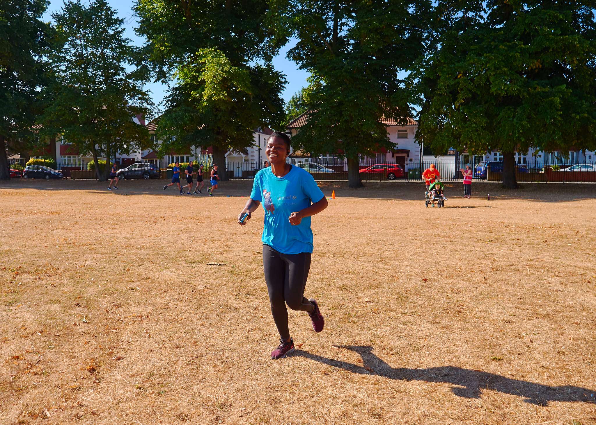 black woman running and smiling