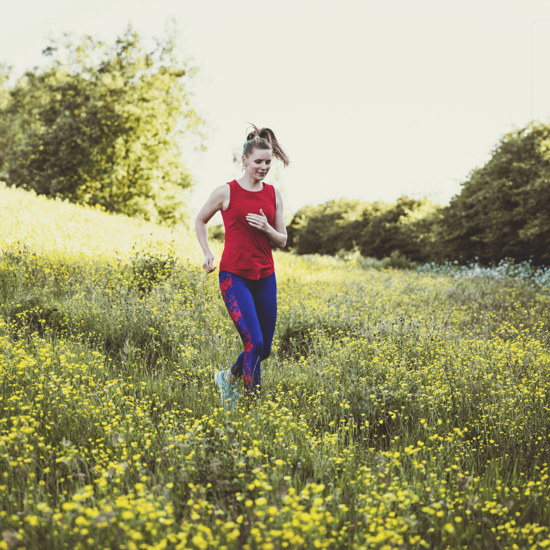 Wiman jogging through field of yellow flowers